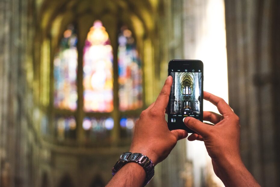person taking picture of inside church